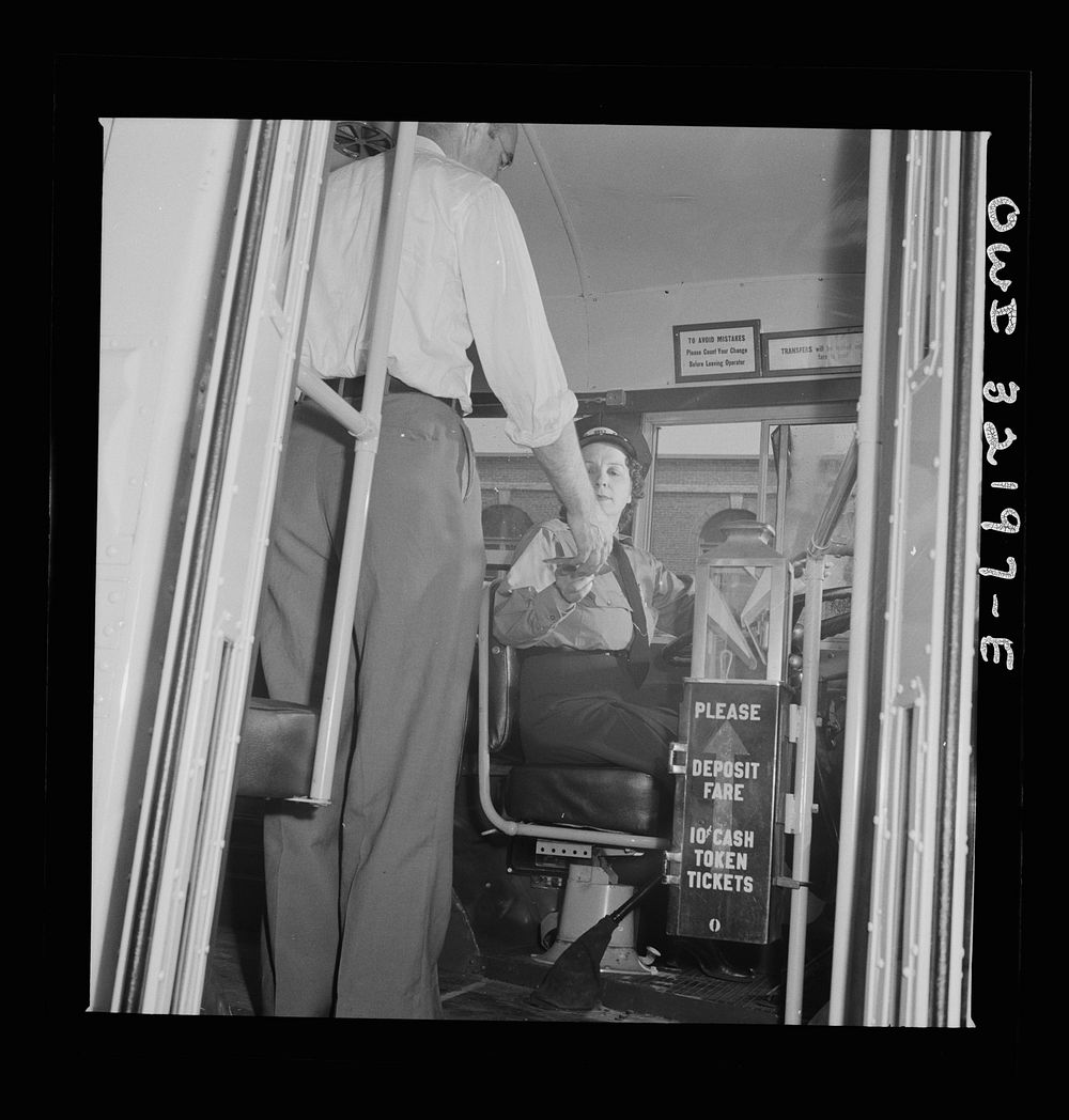 [Untitled photo, possibly related to: Washington, D.C. An instructor of the Capitol Transit Company teaching a woman to…