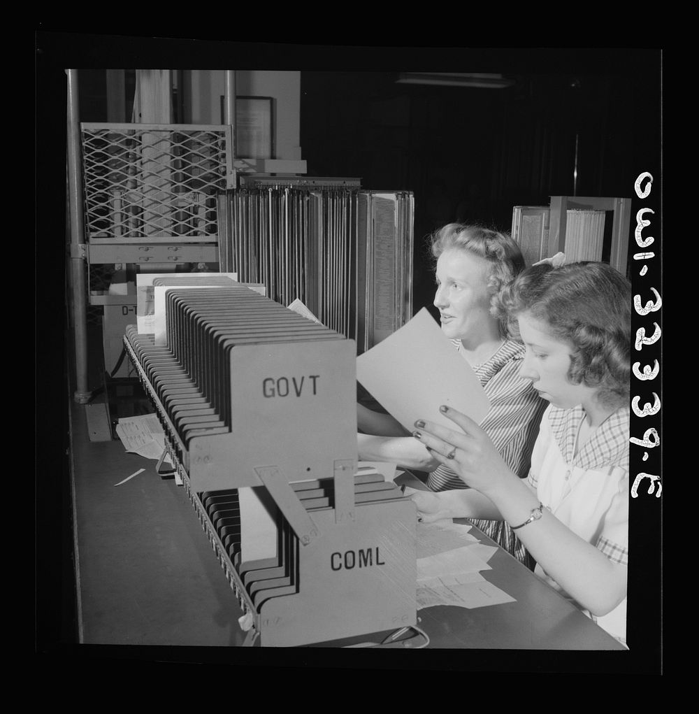 Washington, D.C. Miss Louis Crist and Medora Corrick working in the routing center at the Western Union telegraph office.…