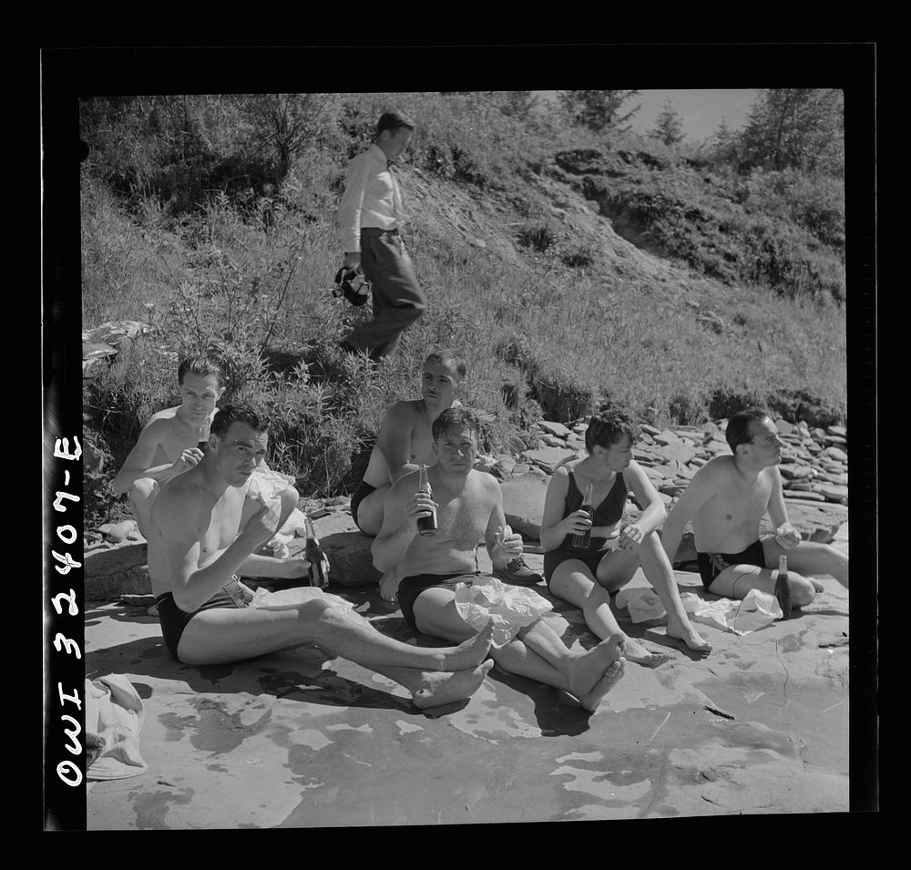 [Untitled photo, possibly related to: Oswego, New York. United Nations heroes eating a picnic lunch after swimming in Lake…