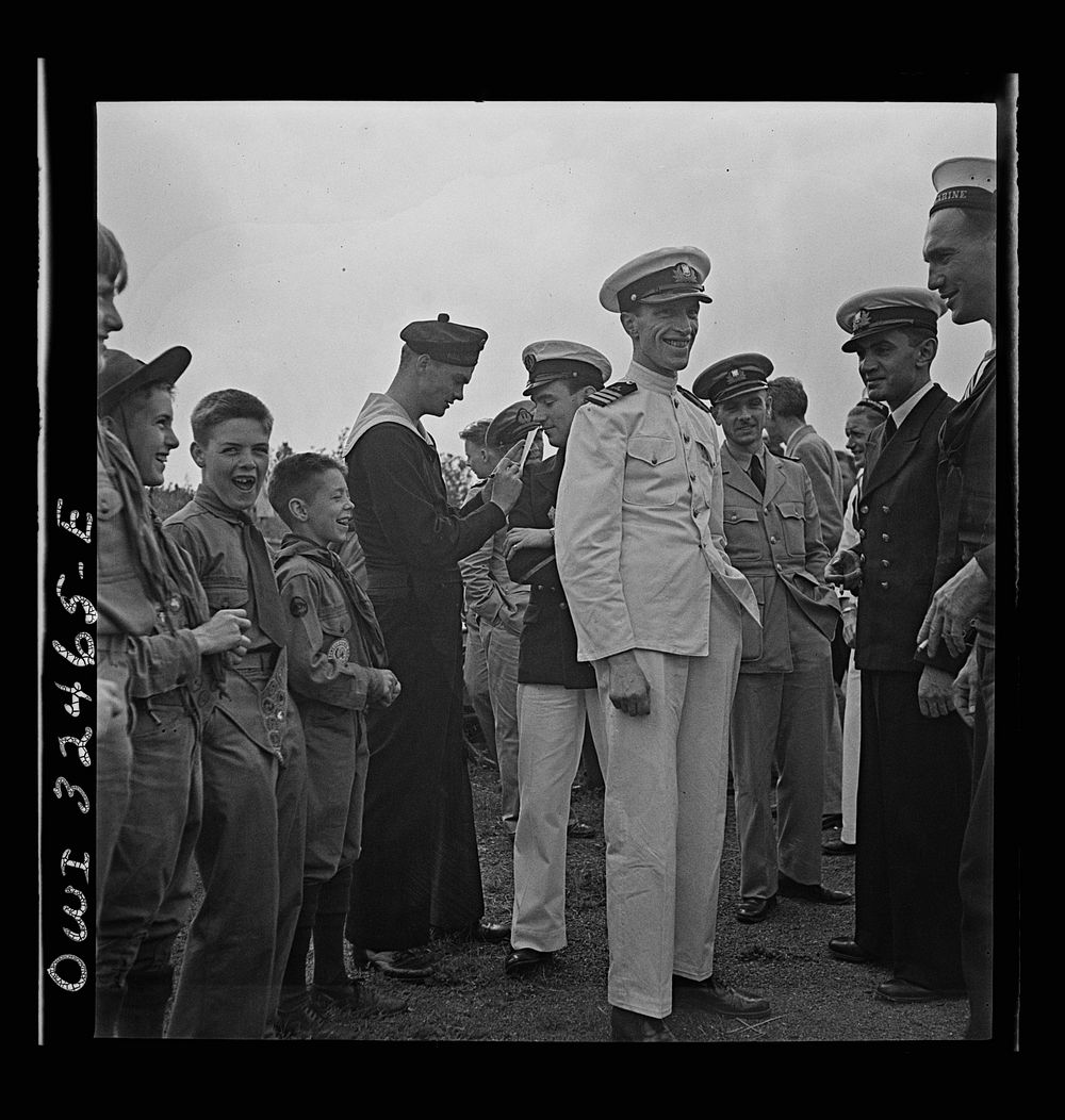 [Untitled photo, possibly related to: Oswego, New York. Boy scouts getting autographs from the United Nations heroes on Flag…