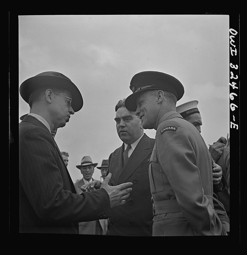 Oswego, New York. Canadian flight commander chatting with Oswegans on Flag Day during United Nations week. Sourced from the…