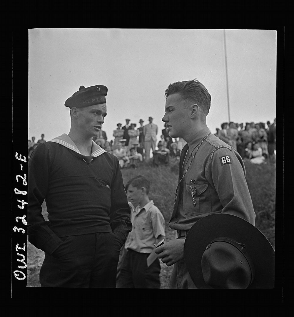[Untitled photo, possibly related to: Oswego, New York. Boy scout giving an insignia to a Norwegian naval officer and sailor…