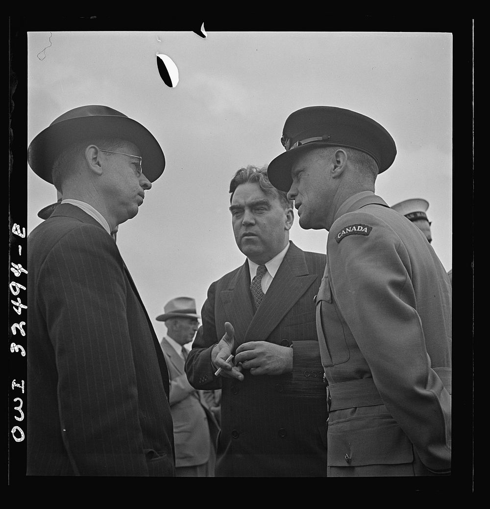 [Untitled photo, possibly related to: Oswego, New York. Canadian flight commander chatting with Oswegans on Flag Day during…