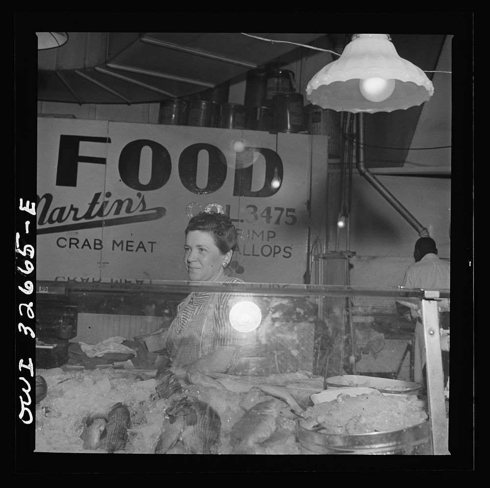 [Untitled photo, possibly related to: Washington, D.C. Blanche Beavers waiting on a customer in the Arcade seafood market].…