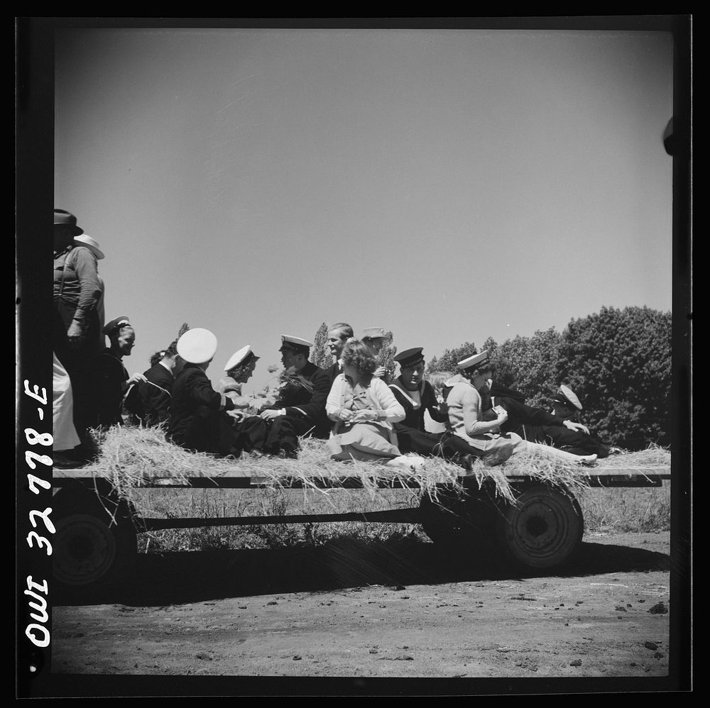 [Untitled photo, possibly related to: Oswego, New York. Belgian sailor leads singing on a hayride for the United Nations…