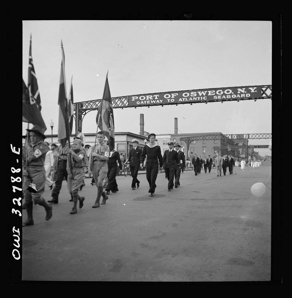 Oswego, New York. United Nations heroes marching behind the boy scouts carrying flags in the United Nations week parade.…