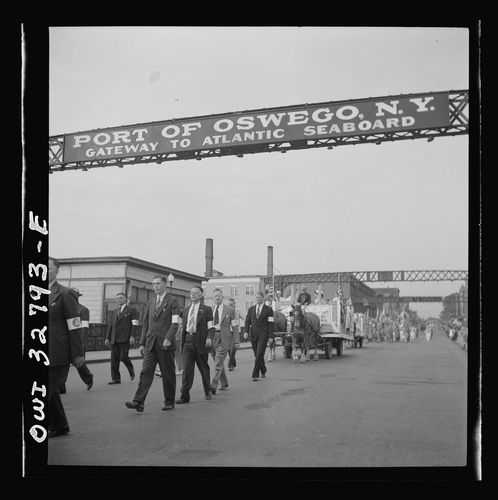 [Untitled photo, possibly related to: Oswego, New York. United Nations heroes marching behind the boy scouts carrying flags…