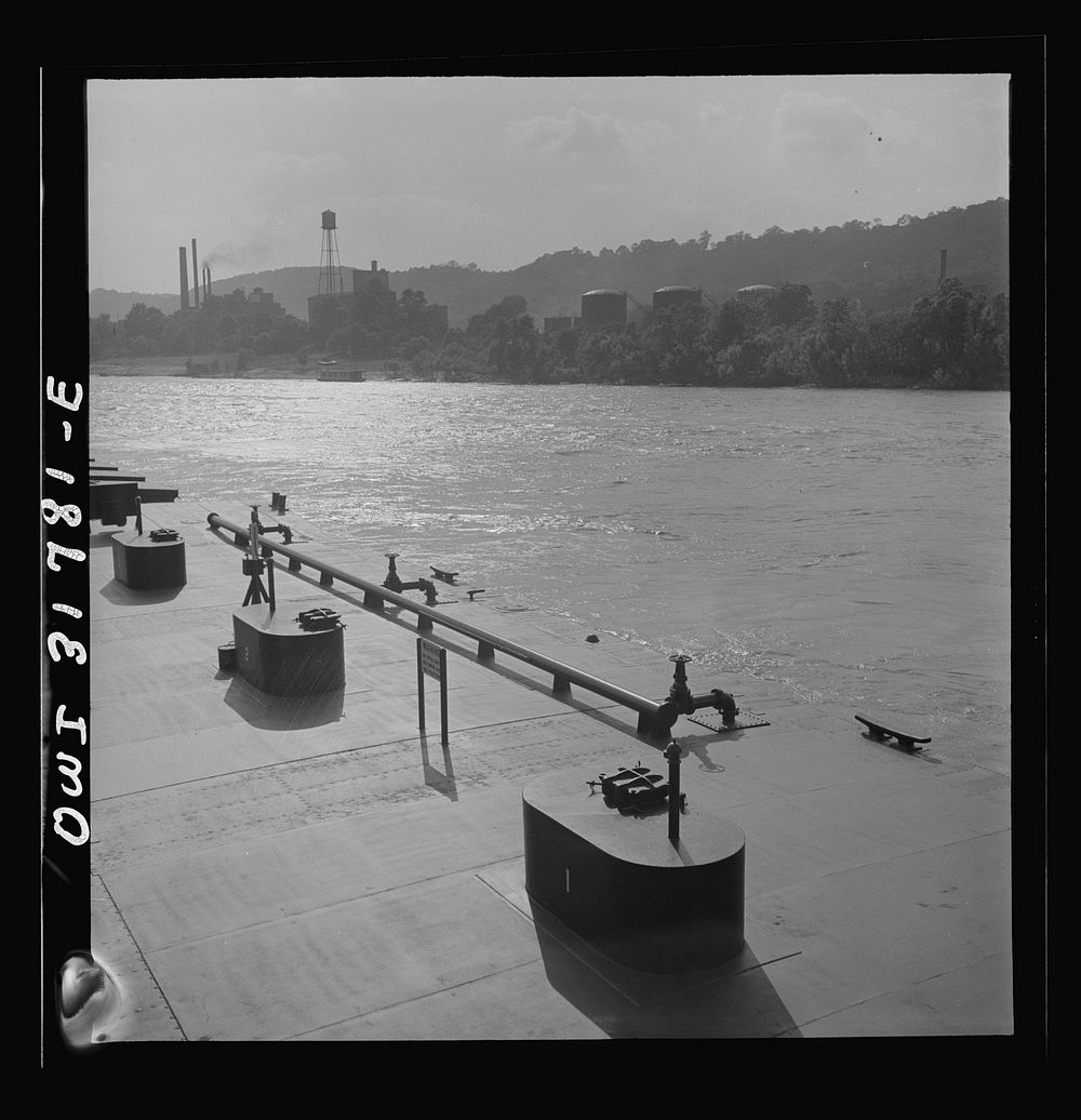 Cincinnati (vicinity), Ohio. Detail of the piping on the oil barges in the tow of the towboat Ernest T. Weir going down the…