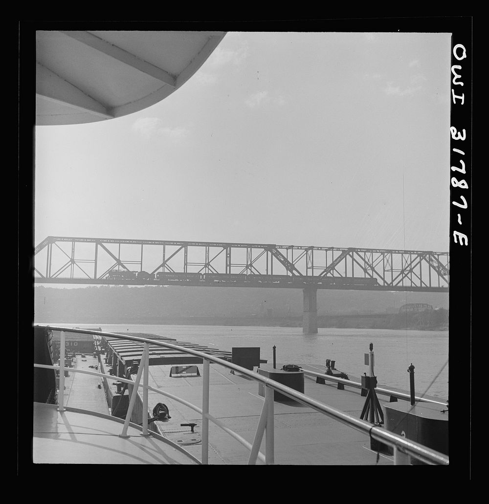 [Untitled photo, possibly related to: Cincinnati (vicinity), Ohio. A bridge over the Ohio River, as seen from the towboat…