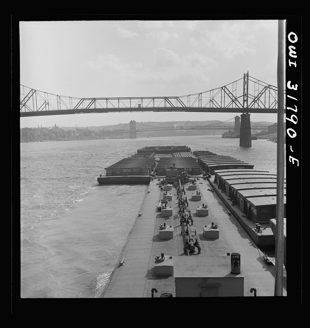 Cincinnati (vicinity), Ohio. The Cincinnati bridge as seen from the towboat Ernest T. Weir going down the Ohio River.…