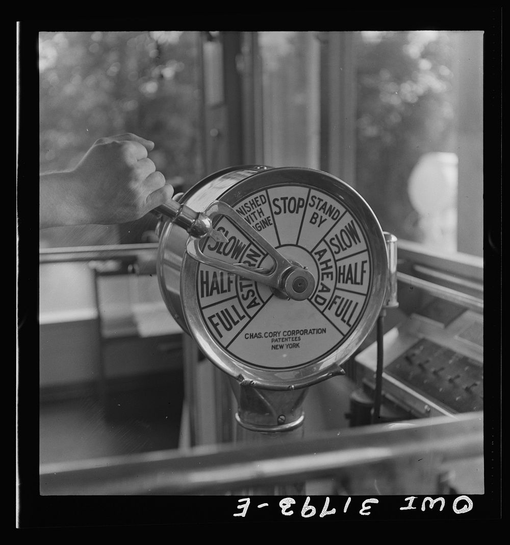 Detail of the controls in the pilot house of the towboat Ernest T. Weir going down the Ohio River to Cincinnati. Sourced…