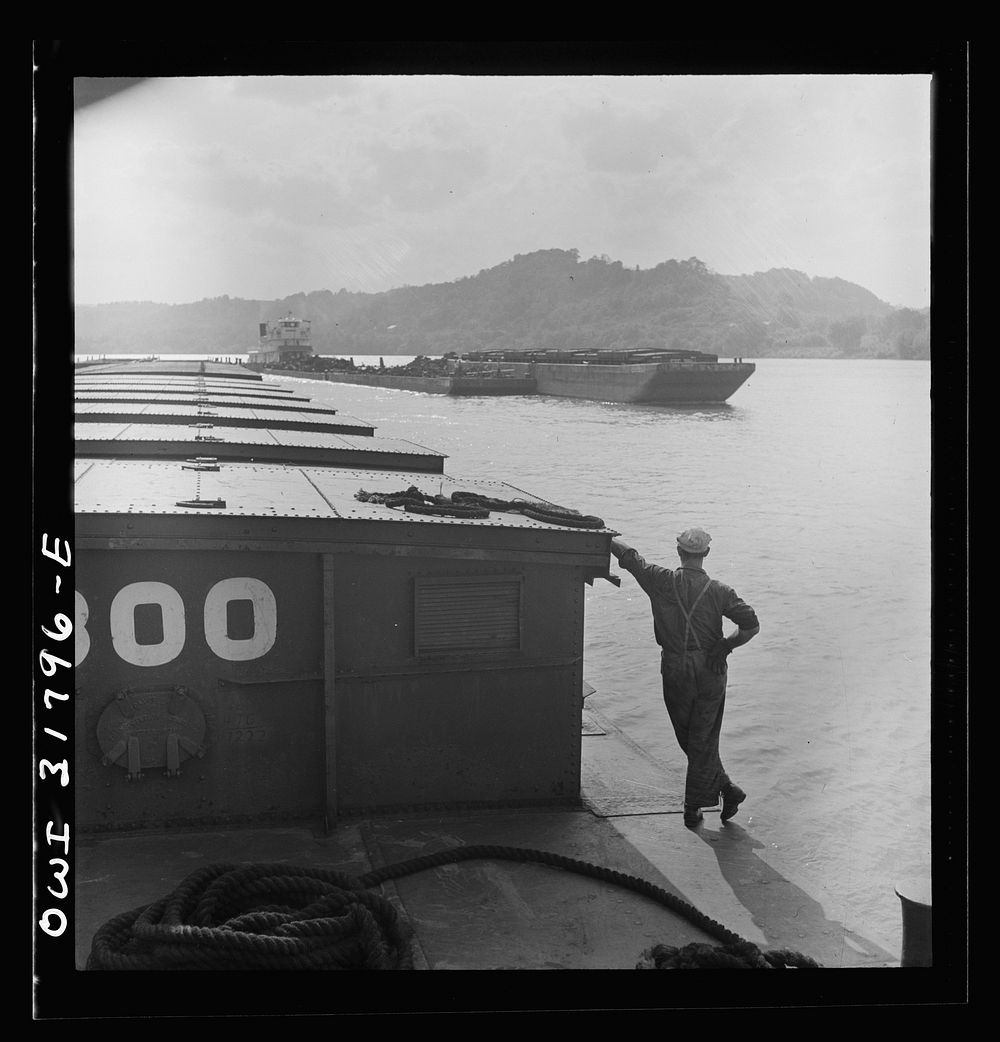 A passing towboat as seen from the towboat Ernest T. Weir going down the Ohio River to Cincinnati. Sourced from the Library…
