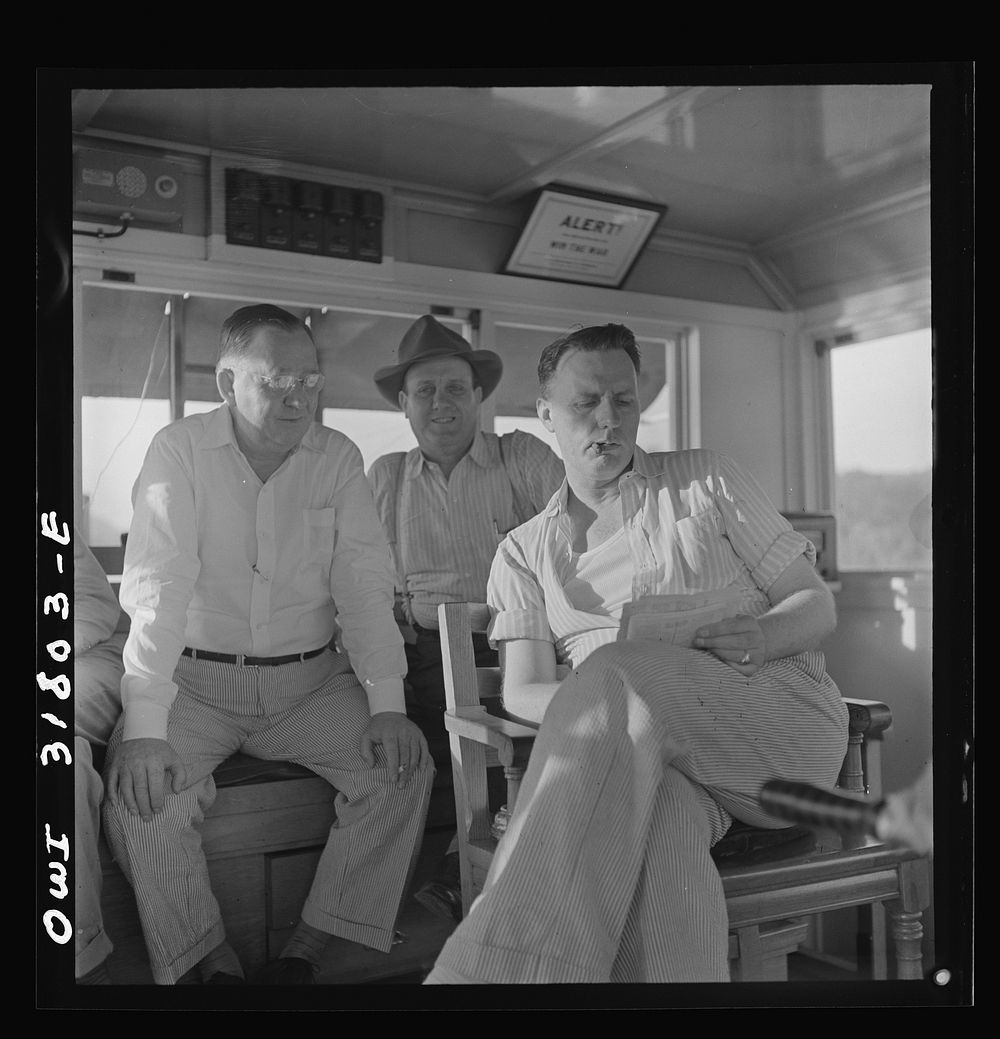 The captain and two pilots aboard the towboat Ernest T. Weir going down the Ohio River to Cincinnati. Sourced from the…
