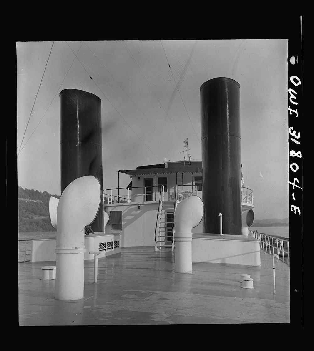 Stacks in the deck of the towboat Ernest T. Weir going down the Ohio River to Cincinnati. Sourced from the Library of…