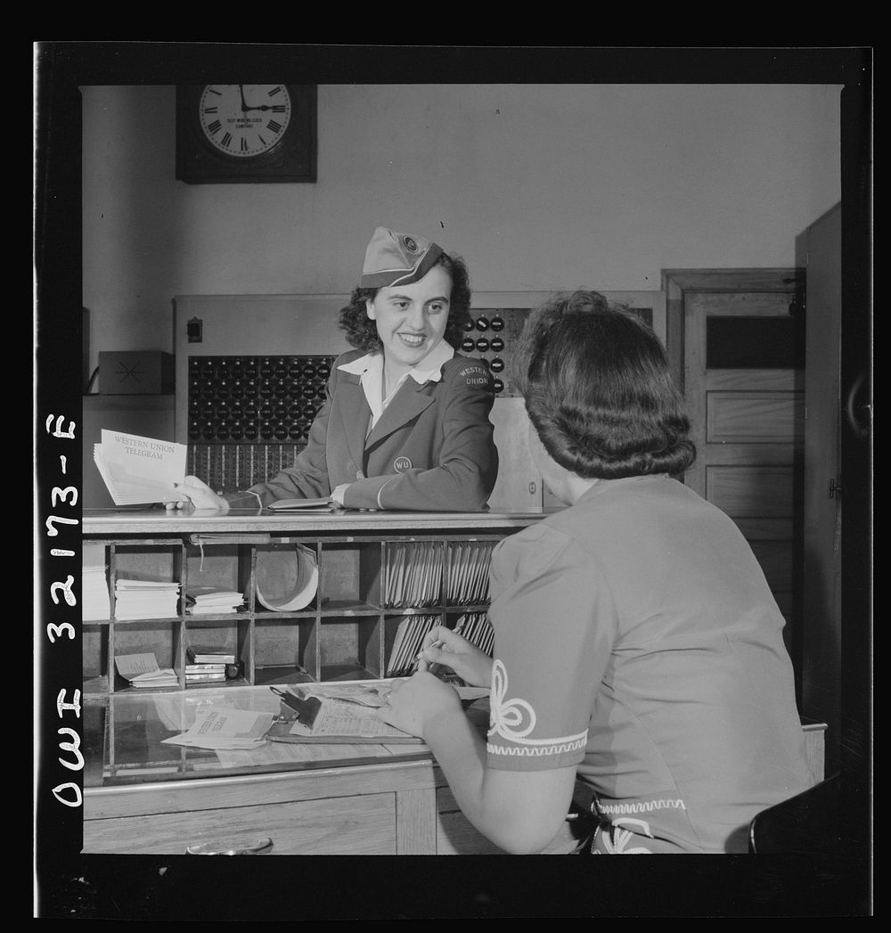 Washington, D.C. Miss Dorothy Lutz, a Western Union telegraph messenger, getting a sheaf of telegrams to deliver. Sourced…