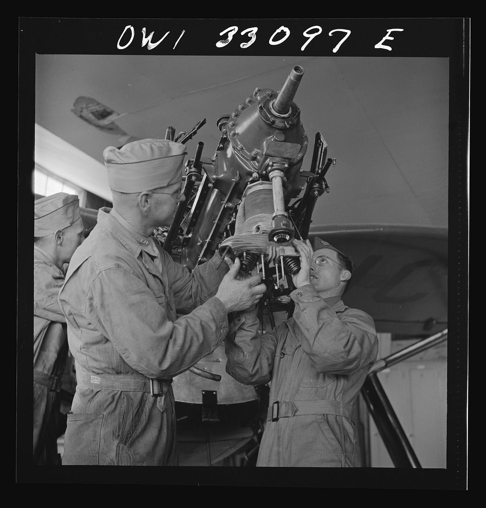 Bar Harbor, Maine. Civil Air Patrol base headquarters of coastal patrol no. 20. Replacing the cylinders in a plane after…