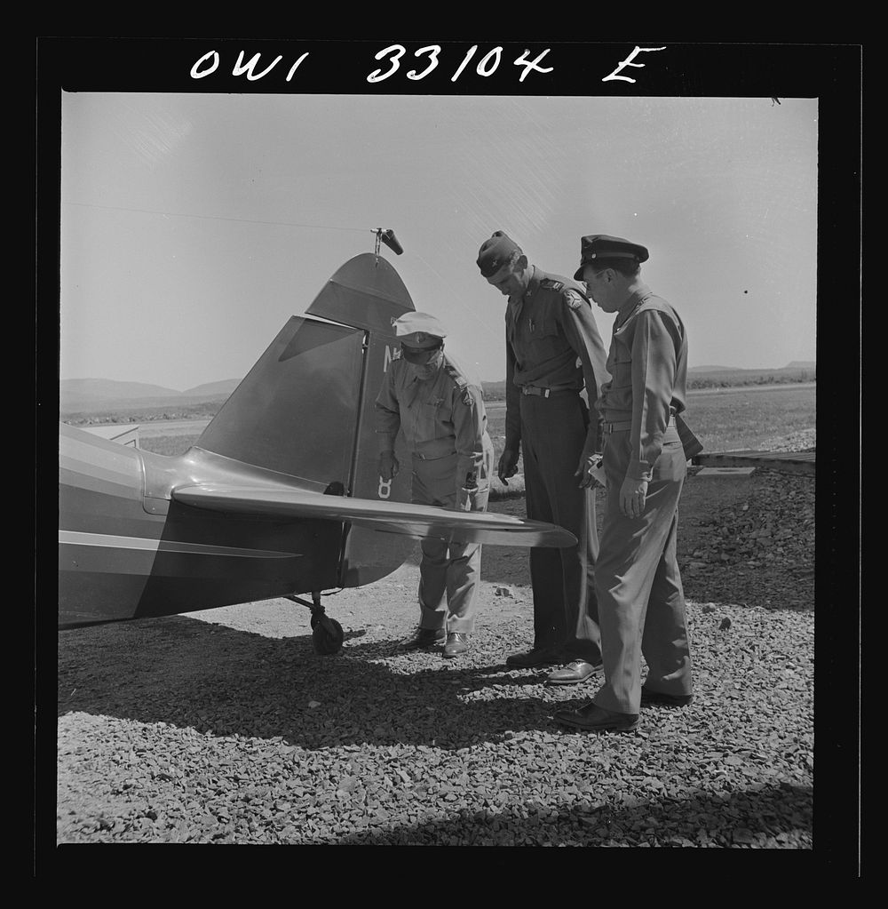 Bar Harbor, Maine. Civil Air Patrol base headquarters of coastal patrol no. 20. Major James B. King, base commander, on a…