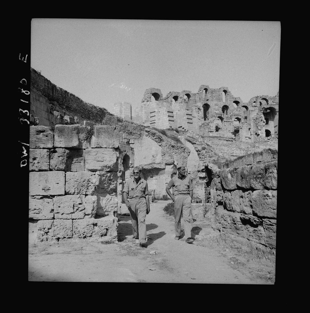 [Untitled photo, possibly related to: American troops of the 57th Fighter Group sightseeing among Roman ruins in Tunisia].…
