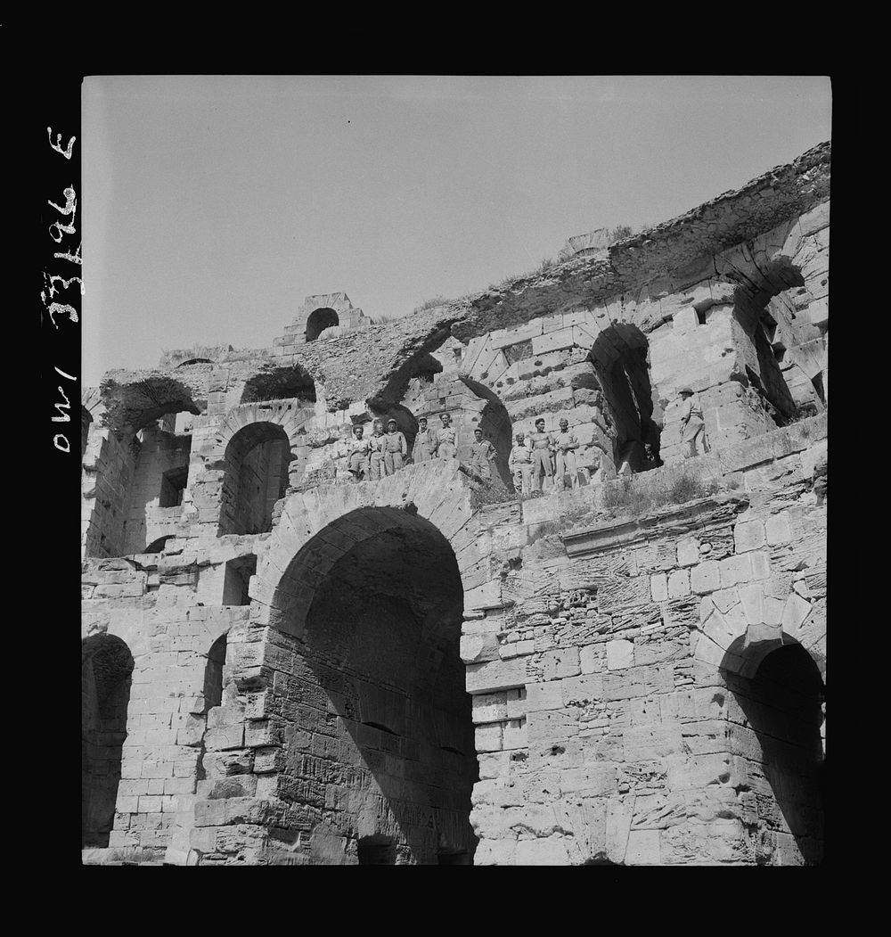 American troops of the 57th Fighter Group sightseeing among Roman ruins in Tunisia. Sourced from the Library of Congress.