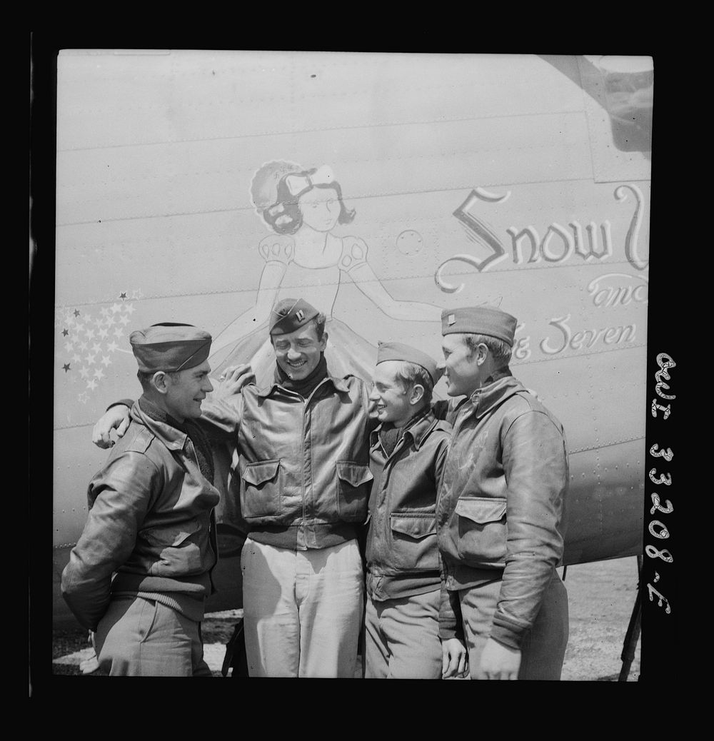 Snow White, a B-24 bomber of the U.S. Army 9th Air Force at a forward bomber base in the Libyan desert. Among its crew…