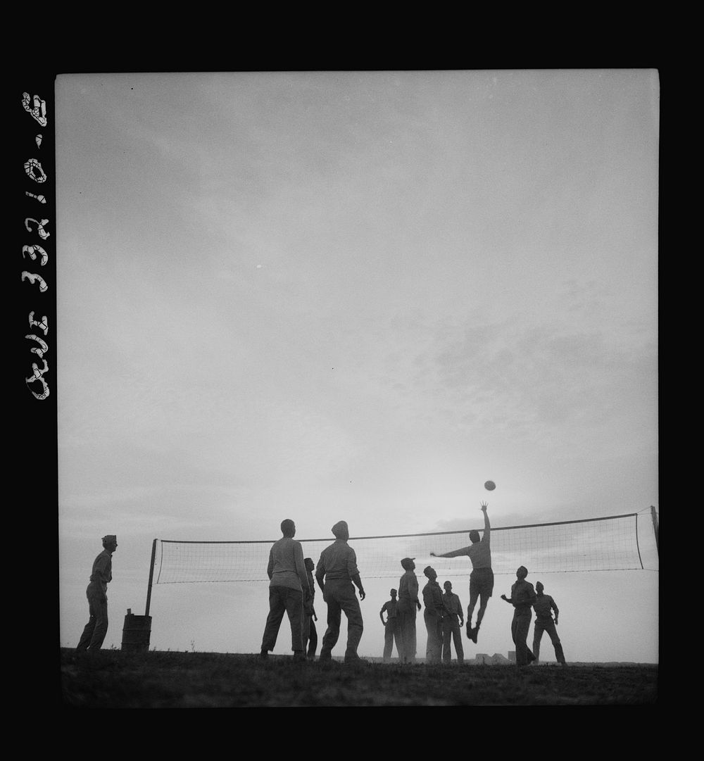 Men of the 57th Fighter Group relaxing with a game of volleyball somewhere in Tunisia. Sourced from the Library of Congress.