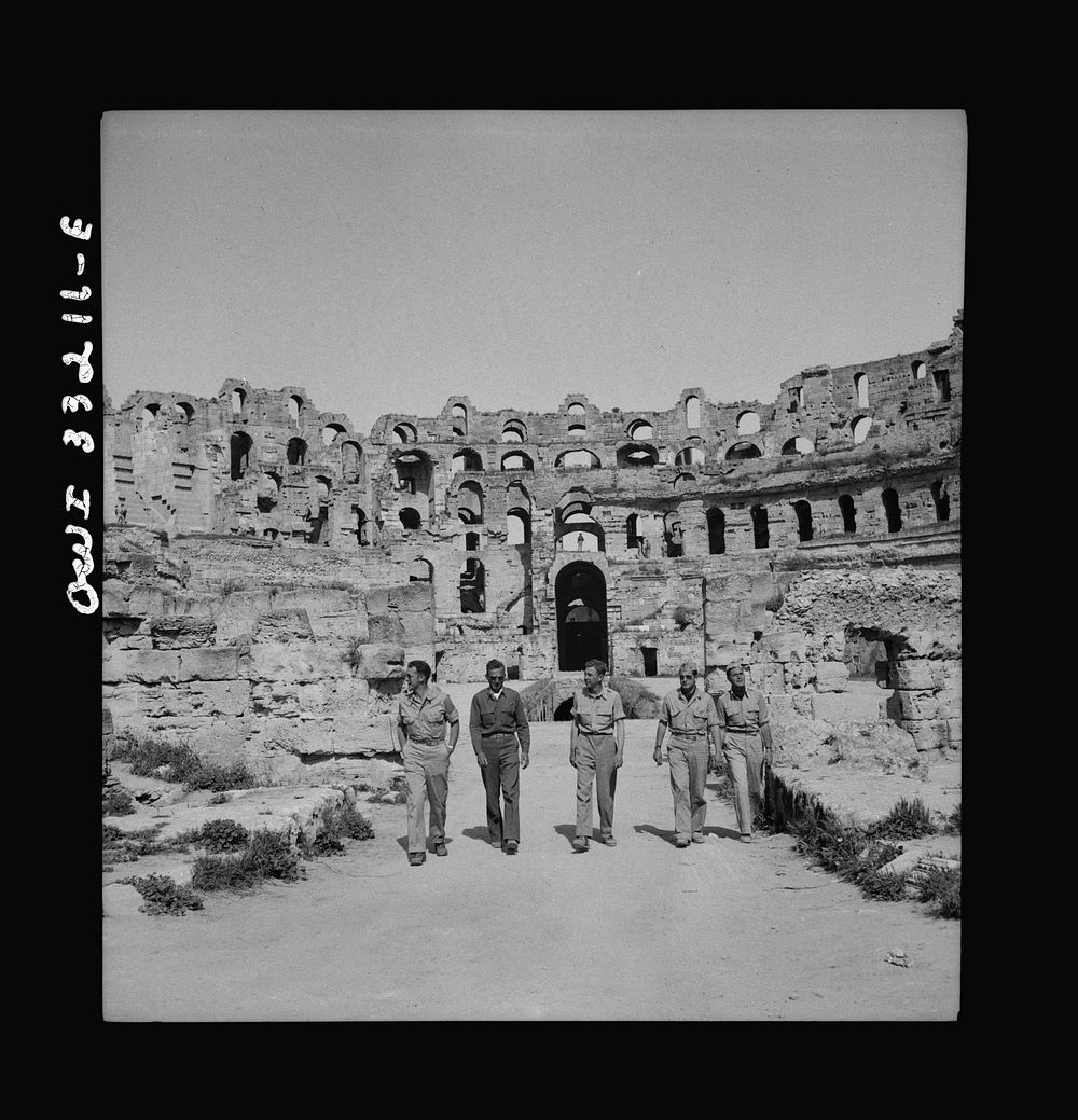 American troops of the 57th Fighter Group sightseeing among Roman ruins in Tunisia. Sourced from the Library of Congress.