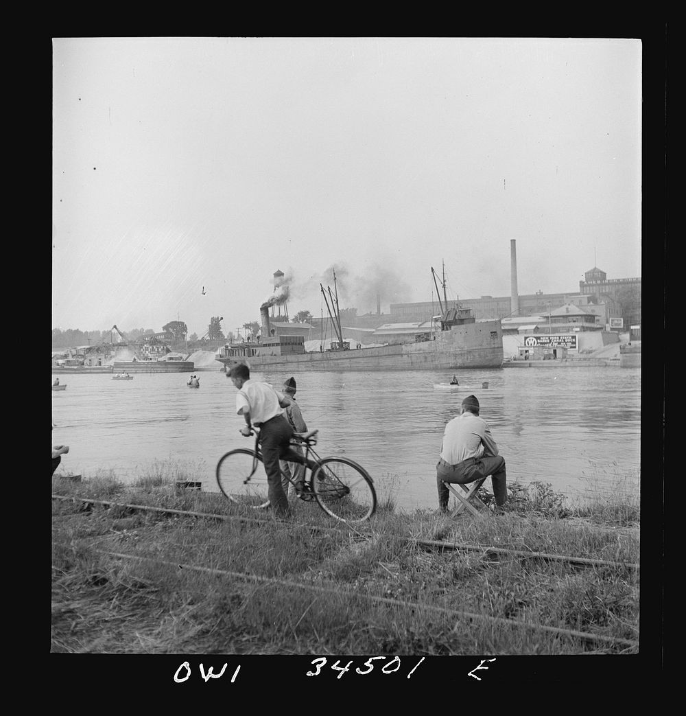 [Untitled photo, possibly related to: Oswego, New York. Sunday fishermen on the Oewego River opposite the bauxite docks].…