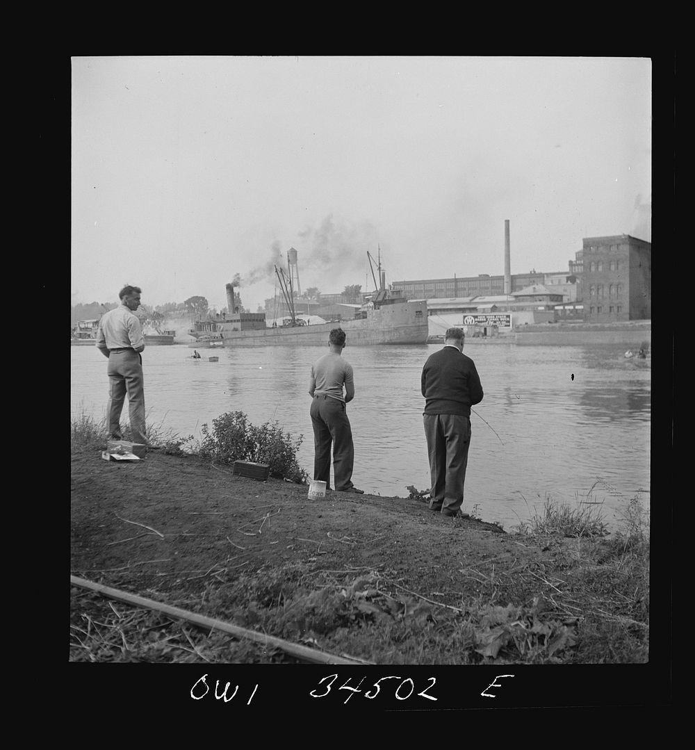 Oswego, New York. Sunday fishermen on the Oewego River opposite the bauxite docks. Sourced from the Library of Congress.