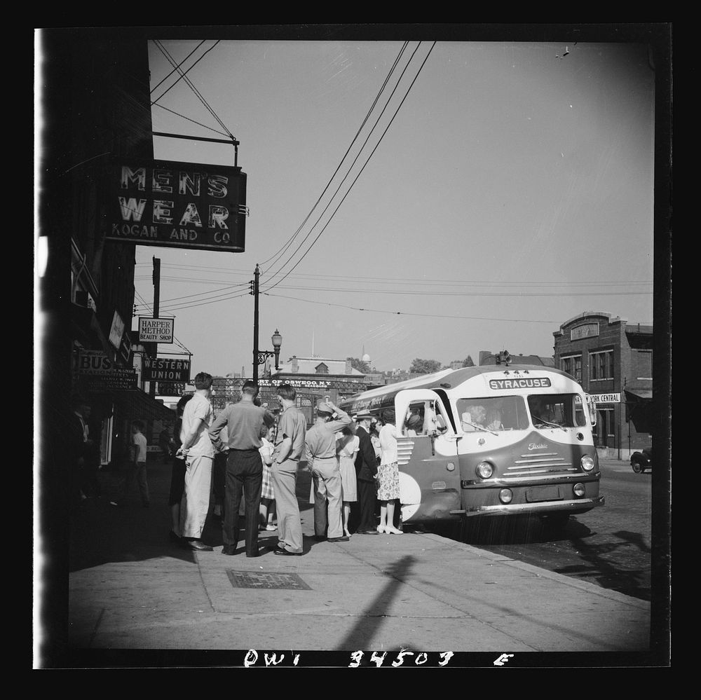 [Untitled photo, possibly related to: Oswego, New York. Boarding a Syracuse bus on Bridge Street]. Sourced from the Library…