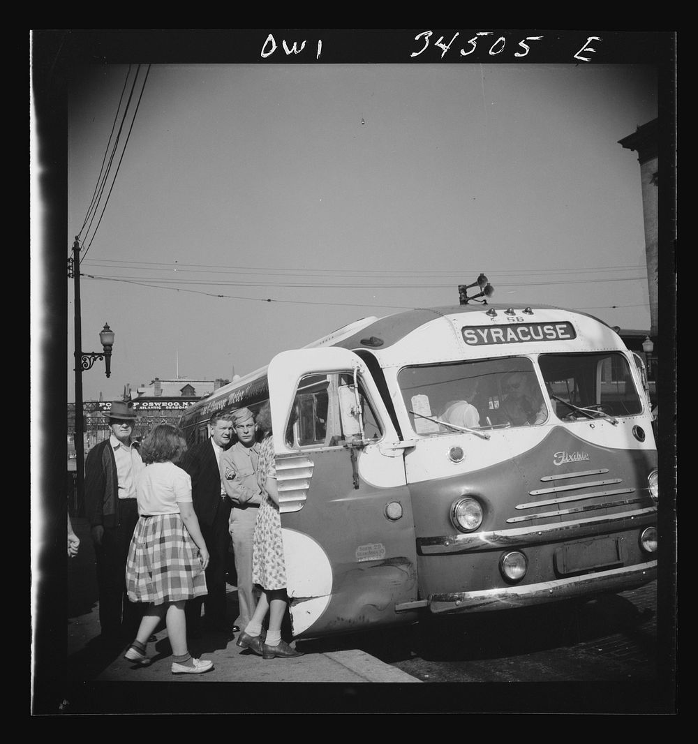 [Untitled photo, possibly related to: Oswego, New York. Boarding a Syracuse bus on Bridge Street]. Sourced from the Library…
