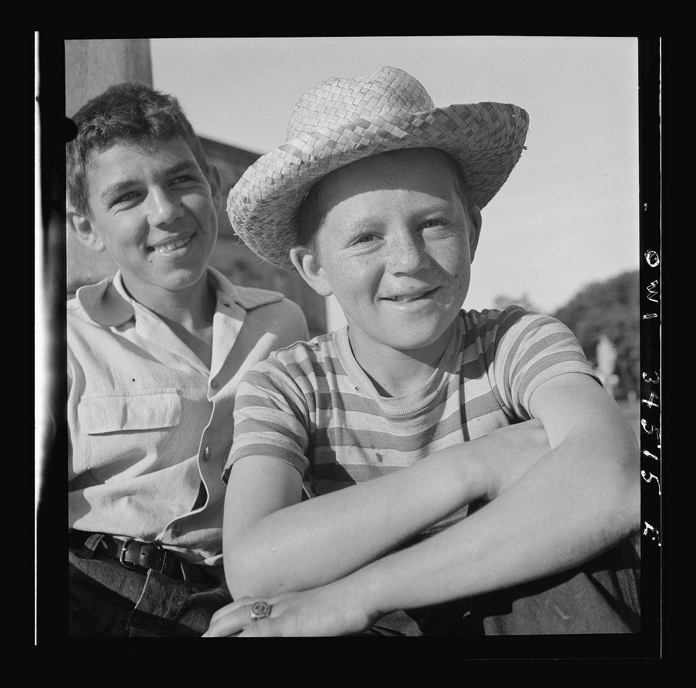 Oswego, New York. Boys recruited to work on the farms during the summer waiting to be picked up by the farmers at 7:30 a.m..…