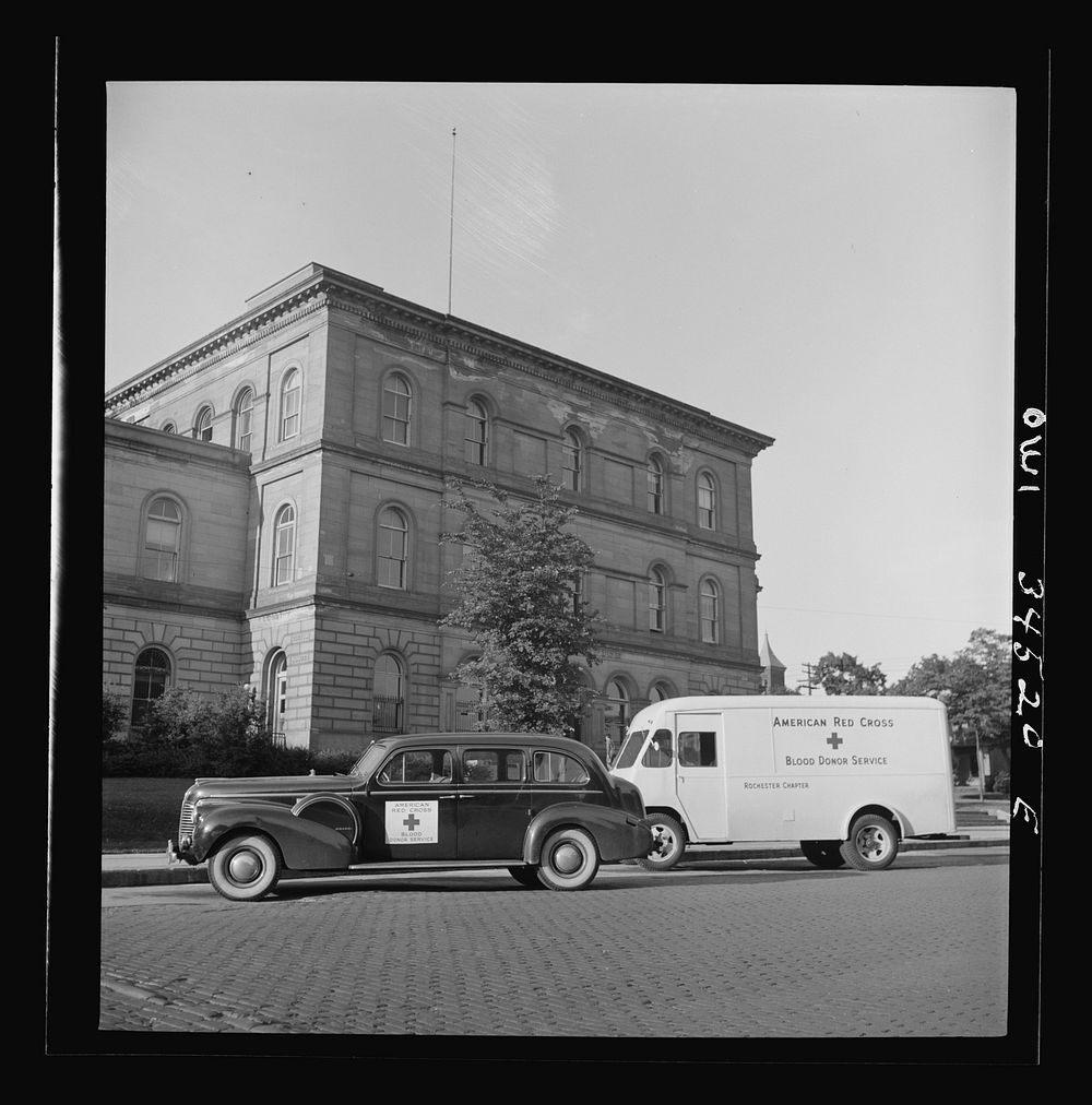 Oswego, New York. Red Cross blood donor service cars from Syracuse, New York parked outside the post office. One thousand…