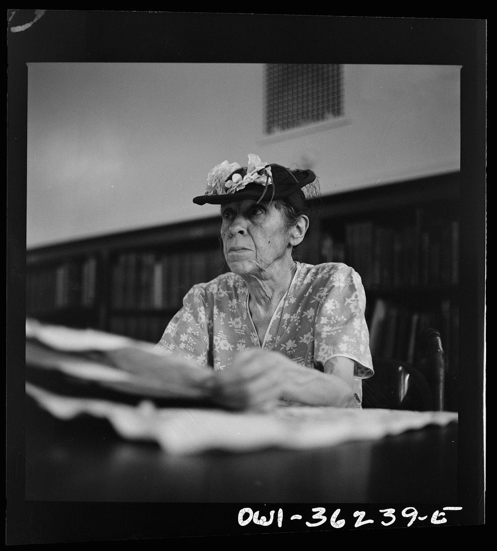 [Untitled photo, possibly related to: Washington, D.C. A woman in the reading room of a public library]. Sourced from the…