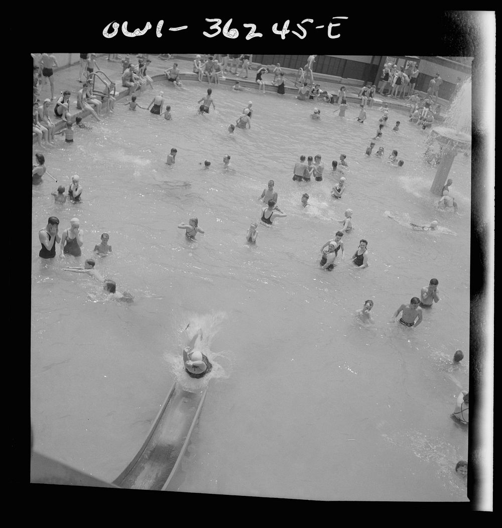 Glen Echo, Maryland. A bather sliding down the waterslide at the Glen Echo swimming pool. Sourced from the Library of…