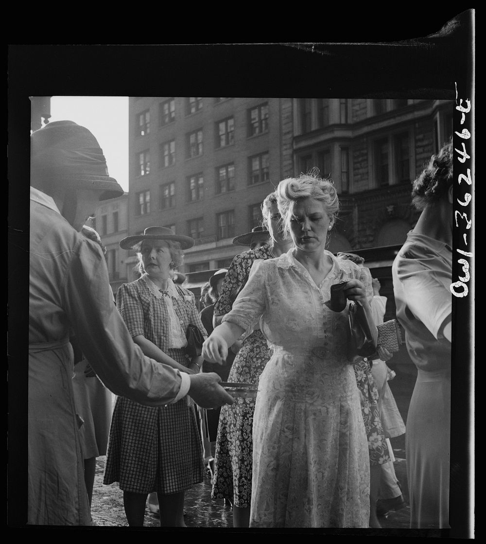 Washington, D.C. A woman giving money to a worker for the American rescue society. Sourced from the Library of Congress.