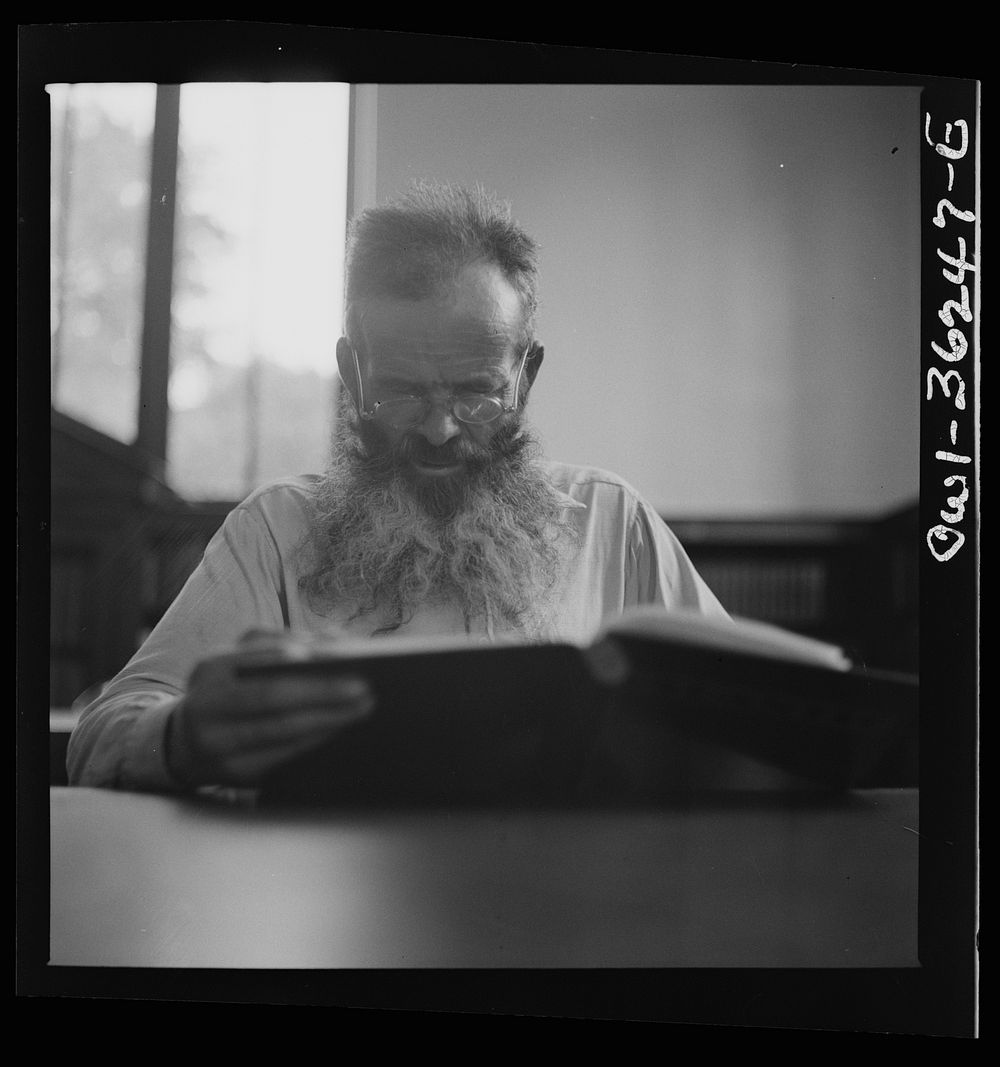 [Untitled photo, possibly related to: Washington, D.C. A man in the reading room of a public library]. Sourced from the…