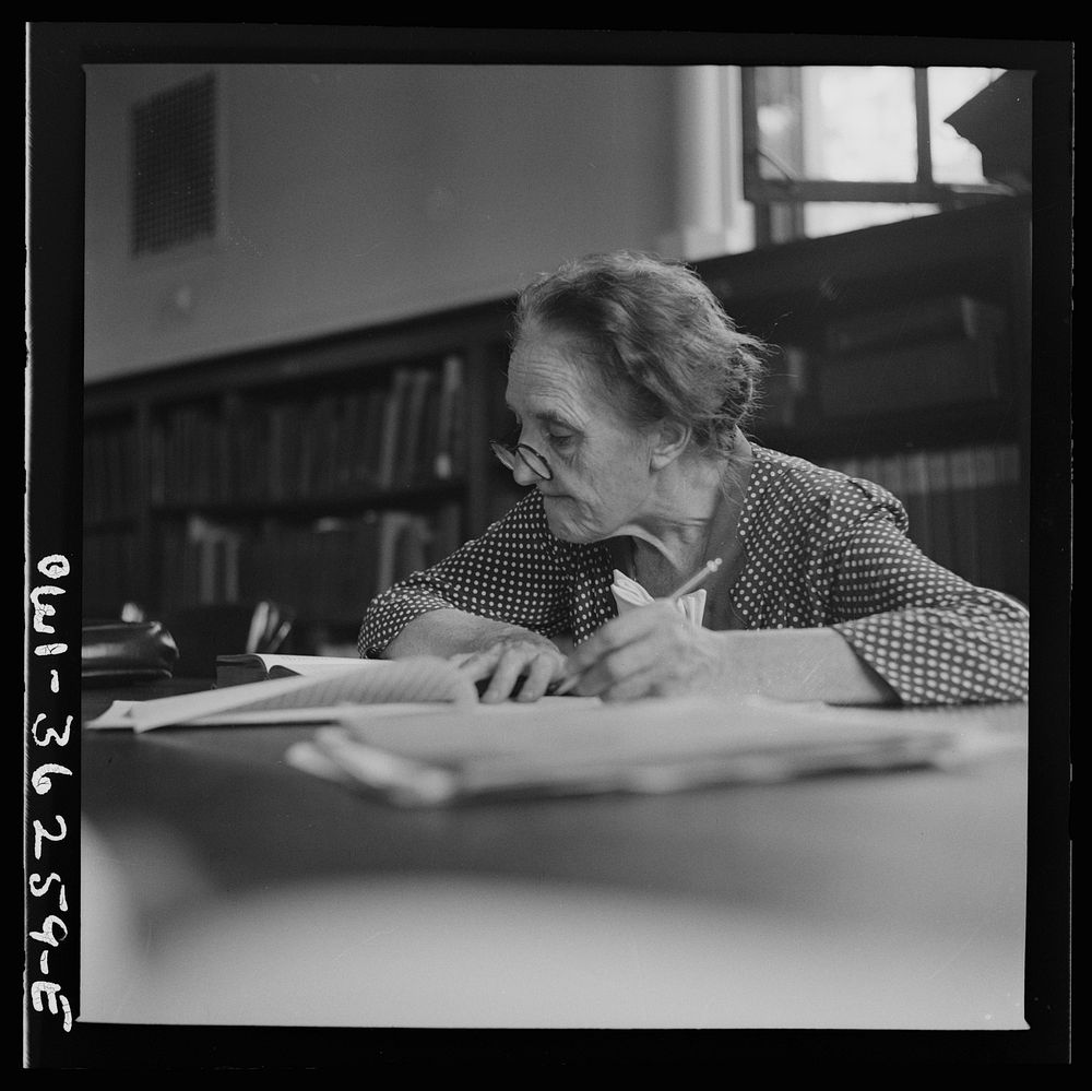 Washington, D.C. A woman in the reading room of a public library. Sourced from the Library of Congress.