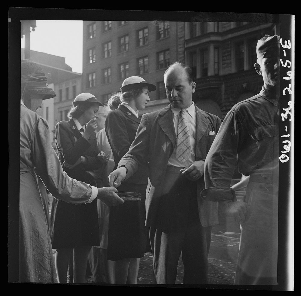 Washington, D.C. A man giving money to a worker for the American Rescue Society. Sourced from the Library of Congress.