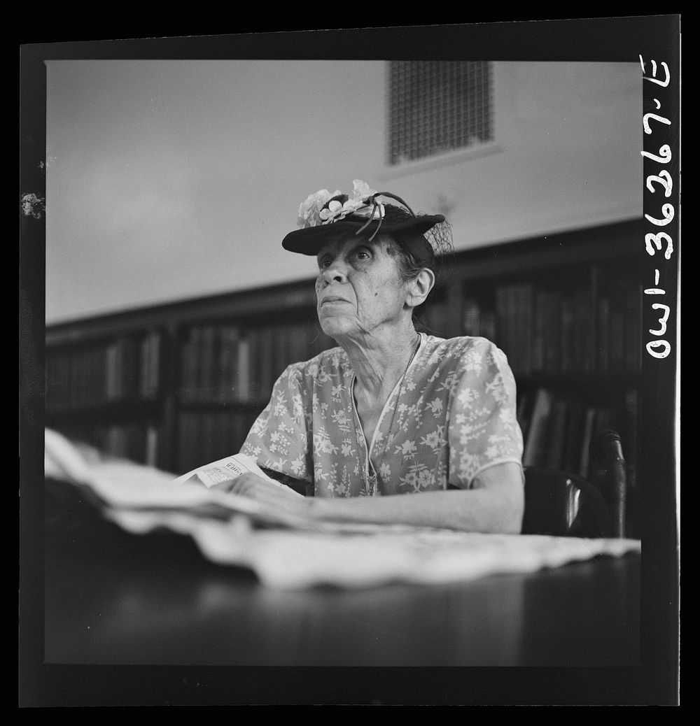 Washington, D.C. A woman in the reading room of a public library. Sourced from the Library of Congress.