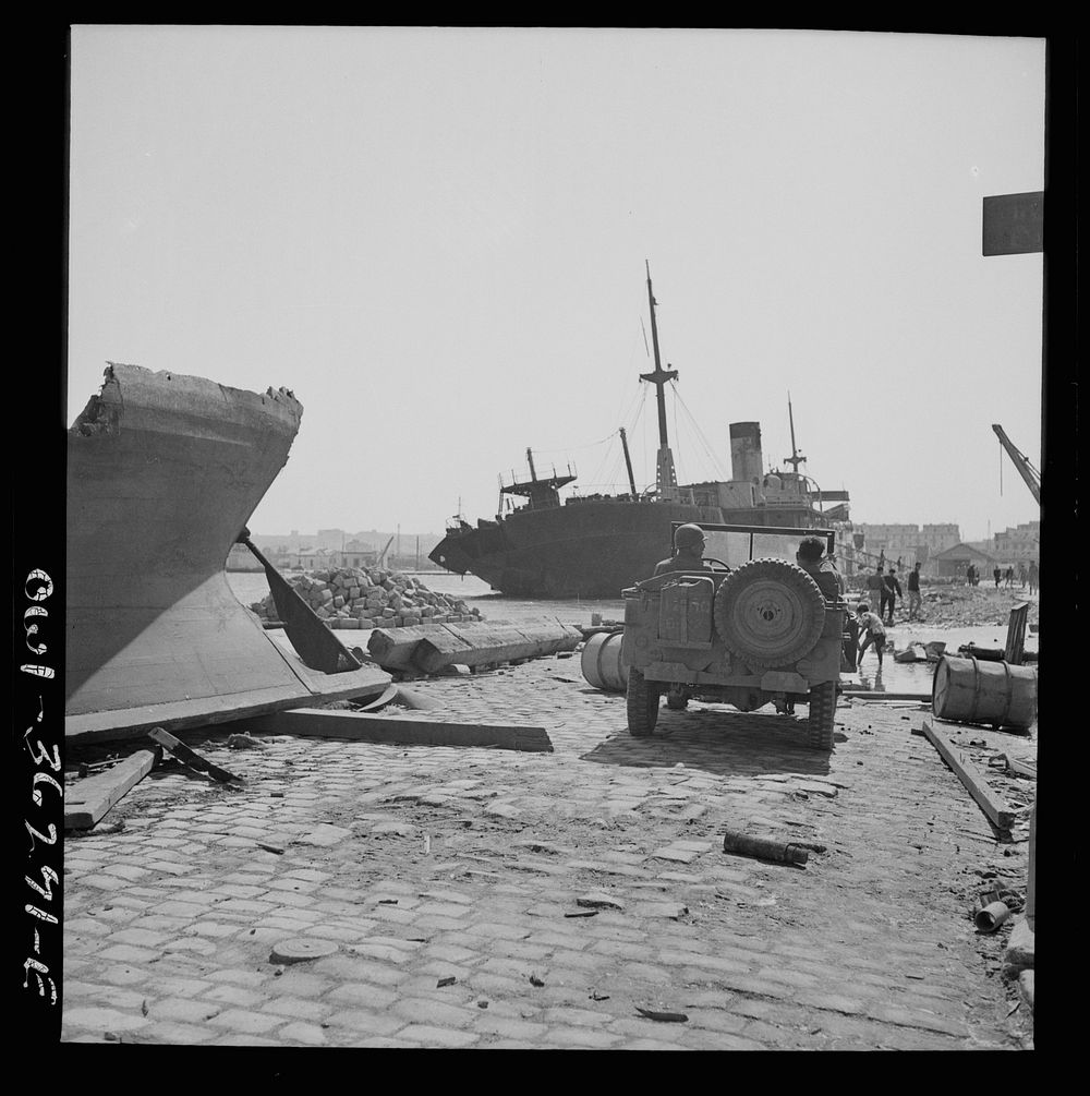 Tunis, Tunisia. American soldiers inspecting wrecked ships in Tunis harbor. Sourced from the Library of Congress.