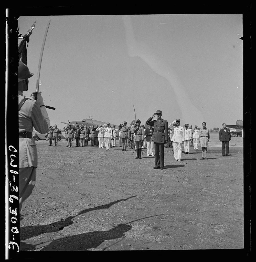 Tunis, Tunisia. General de Gaulle saluting the guard of honor drawn up at the airport to greet him on the occasion of his…
