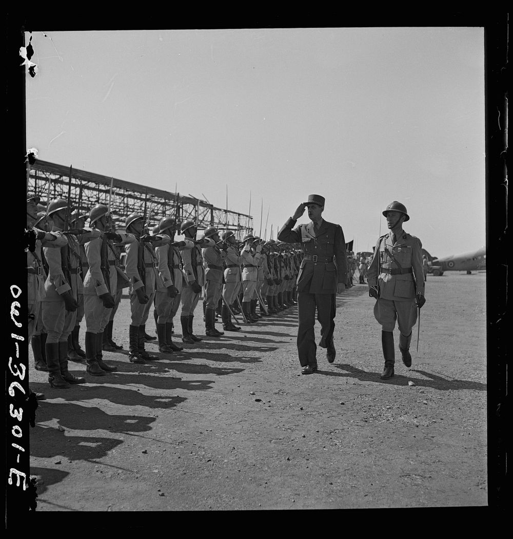 Tunis, Tunisia. General de Gaulle saluting the guard of honor drawn up at the airport to greet him on the occasion of his…