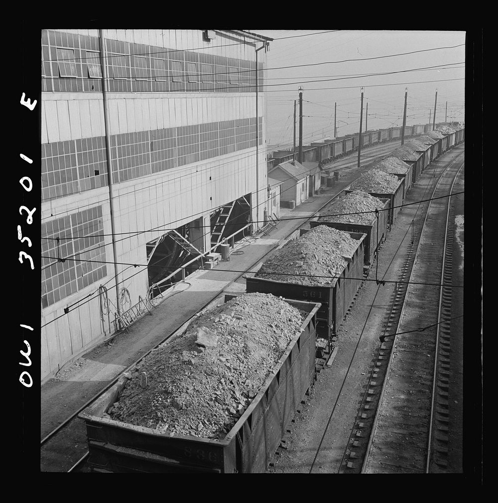 Trains of ore containing copper arriving at one of the large refining plants of the Utah Copper Company. Sourced from the…