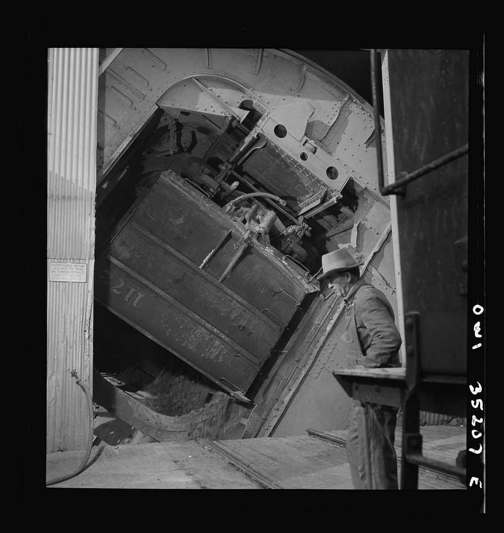 [Untitled photo, possibly related to: Magna, Utah. A rotary car dumper discharging copper ore at the mill]. Sourced from the…