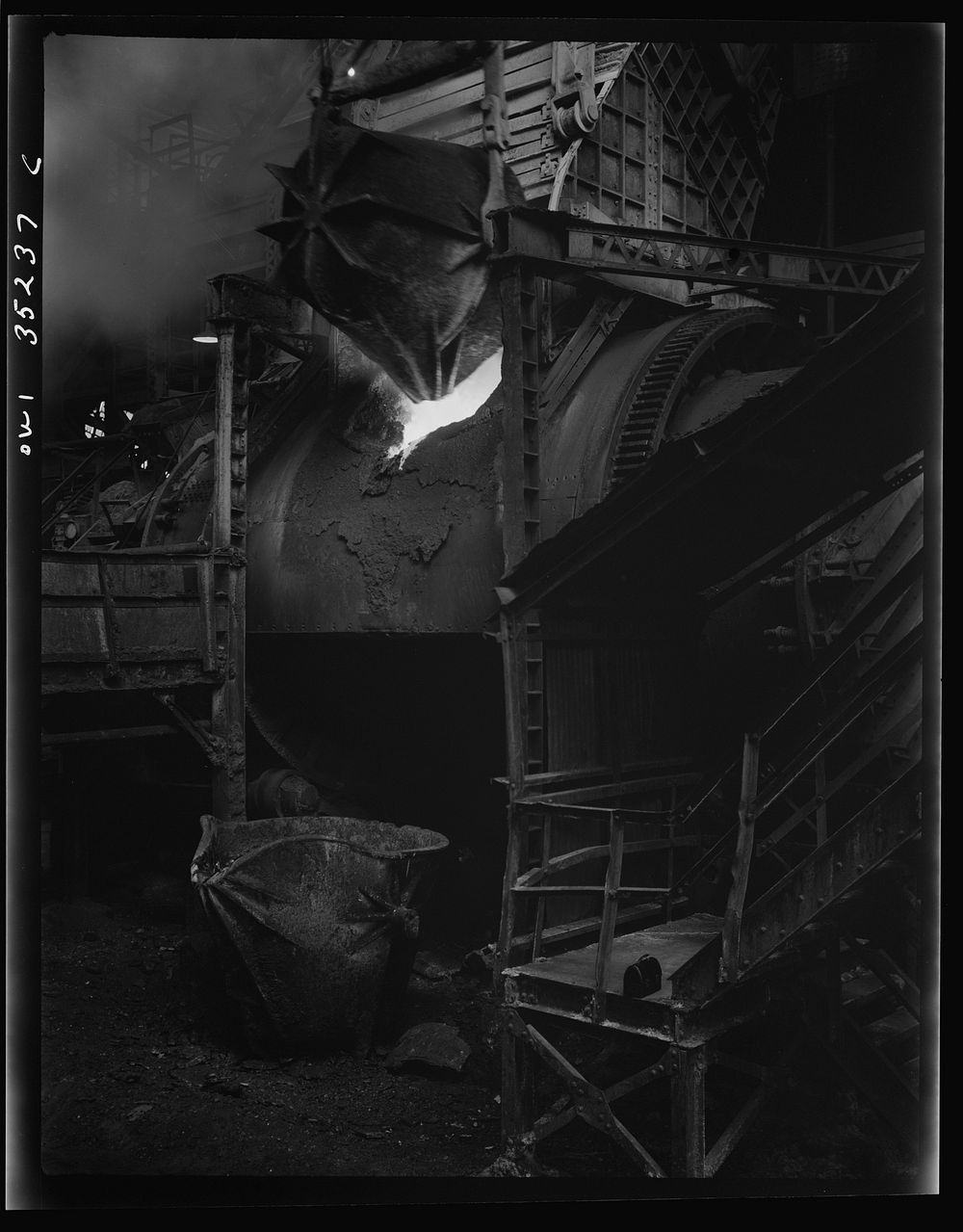 Garfield, Utah. Loading a copper converter at the Garfield smelter of the American Smelting and Refining Company. Sourced…