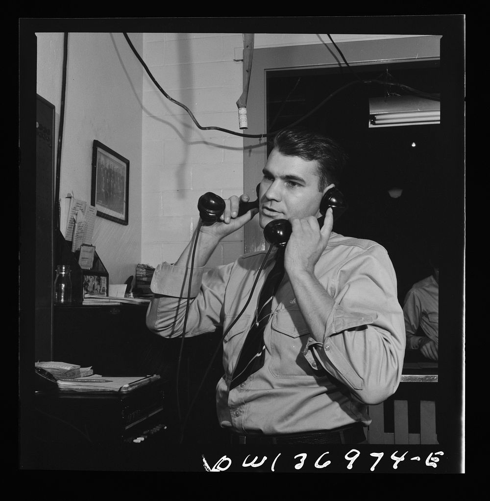 Pittsburgh, Pennsylvania. A dispatcher in the Greyhound garage. Sourced from the Library of Congress.