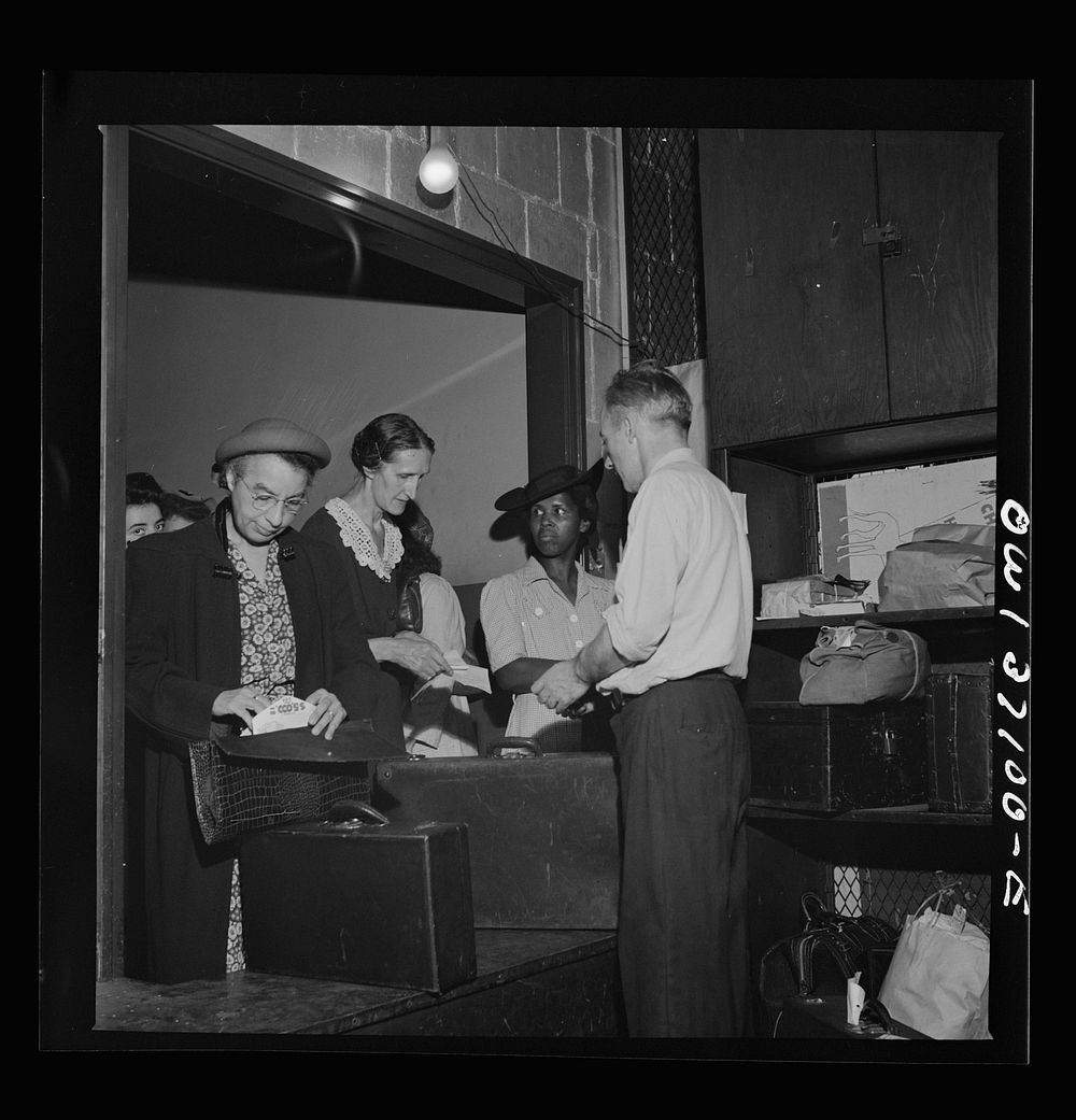 Pittsburgh, Pennsylvania. Passengers checking their bags at the Greyhound bus terminal. Sourced from the Library of Congress.