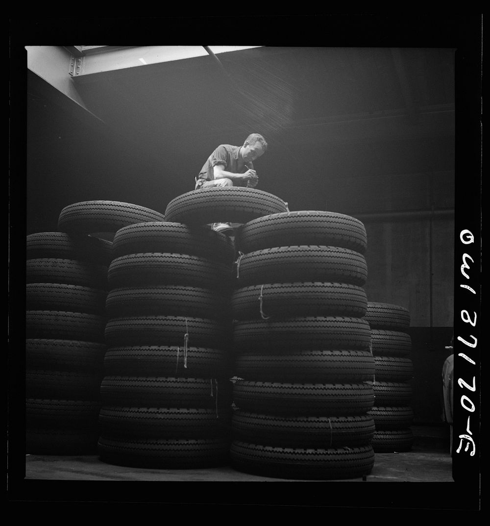 Pittsburgh, Pennsylvania. Checking brand numbers on new tires at the Greyhound garage. Sourced from the Library of Congress.