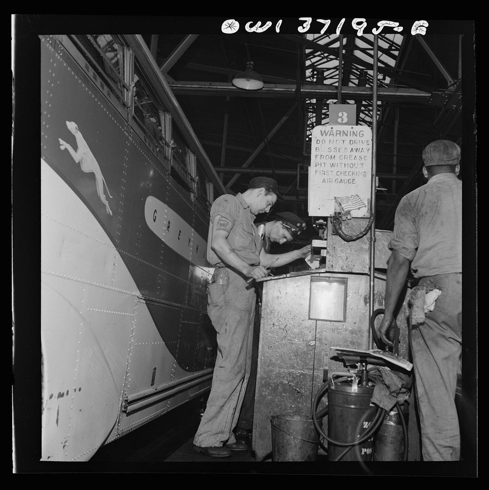 Getting ready to gas a bus at the Greyhound garage. Pittsburgh, Pennsylvania. Sourced from the Library of Congress.
