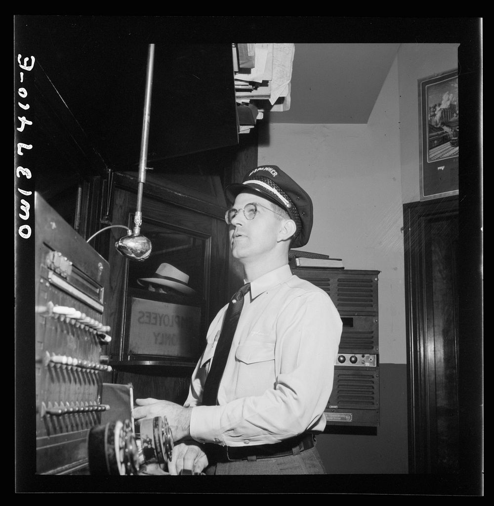 Pittsburgh, Pennsylvania. A starter calling buses at the Greyhound bus terminal. Sourced from the Library of Congress.